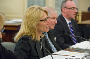 ["A woman identified as Ms. Robinson testifies before the Senate Commerce Committee."]%