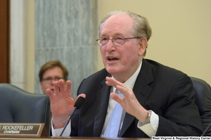 ["Senator John D. (Jay) Rockefeller sits at a Commerce Committee hearing."]%