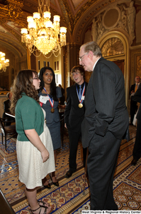 ["Senator John D. (Jay) Rockefeller speaks with three West Virginia high school recipients of the Presidential Scholars program."]%