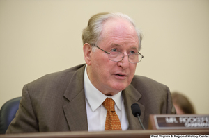 ["Senator John D. (Jay) Rockefeller sits at a Commerce Committee hearing."]%