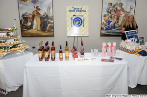 ["This photograph shows a table with Smooth Amber liquors as part of the 150th birthday celebration for West Virginia on Capitol Hill."]%