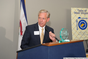 ["A man identified as Steve Roberts speaks at the 150th birthday celebration for West Virginia."]%