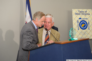 ["Senator Tom Carper and Representative Rahall speak at the 150th birthday celebration for West Virginia."]%