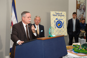 ["Representative David McKinley speaks at the 150th birthday celebration for West Virginia."]%