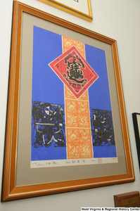 ["Artwork hangs on a wall in Senator Rockefeller's office."]%