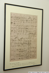 ["A framed copy of Bach sheet music hangs on a wall in Senator John D. (Jay) Rockefeller's office."]%