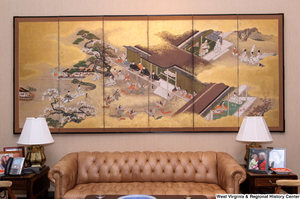 ["A large Japanese panel painting hangs in the sitting space of Senator Rockefeller's personal office."]%