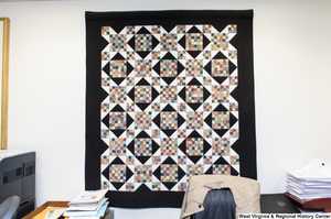 ["A geometric quilt hangs in Senator John D. (Jay) Rockefeller's office."]%