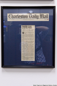 ["A framed Charleston Daily Mail article titled \"Rockefeller stands up for West Virginia\" hangs in Senator John D. (Jay) Rockefeller's office."]%