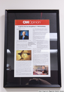 ["A framed CNN Opinion article by Senator John D. (Jay) Rockefeller hangs in his office."]%