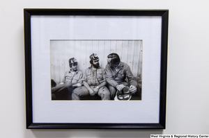 ["Senator John D. (Jay) Rockefeller sits with two West Virginia coal miners."]%