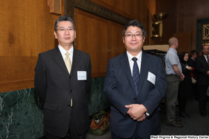 ["Two men stand together at a Welcome to Washington luncheon."]%