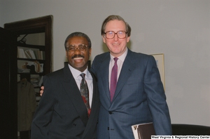["Senator John D. (Jay) Rockefeller with an unidentified man in his office"]%