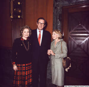 ["Senator John D. (Jay) Rockefeller and his wife Sharon stand with an unidentified individual following the Senate Swearing-In Ceremony."]%