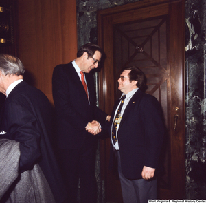 ["Senator John D. (Jay) Rockefeller shakes hands with an unidentified supporter following the Senate Swearing-In Ceremony."]%