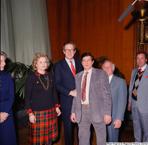 ["Senator John D. (Jay) Rockefeller, Sharon Rockefeller, and unidentified supporters pose for a photo following the Senate Swearing-In Ceremony."]%