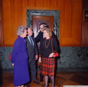 ["Senator John D. (Jay) Rockefeller and his wife Sharon greet two unidentified individuals at the Senate Swearing-In Ceremony."]%