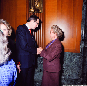 ["Senator John D. (Jay) Rockefeller shakes hands and speaks with an unidentified supporter at the Senate Swearing-In Ceremony."]%