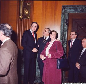["Senator John D. (Jay) Rockefeller poses for a photograph with a group of unidentified supporters at his Senate Swearing-In Ceremony."]%