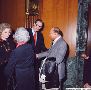 ["Senator John D. (Jay) Rockefeller and his wife Sharon shake hands with unidentified supporters following the Senate Swearing-In Ceremony."]%