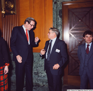 ["Senator John D. (Jay) Rockefeller speaks with an unidentified supporter after the Senate Swearing-In Ceremony."]%