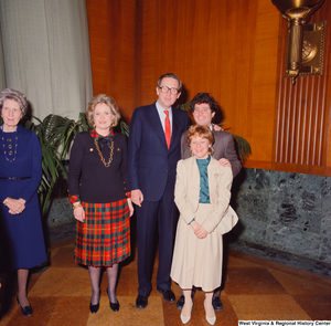 ["Senator John D. (Jay) Rockefeller, his wife Sharon, and two unidentified supporters smile for a photograph after the Senate Swearing-In Ceremony. Senator Robert C. Byrd's wife, Erma, can be seen standing on the left."]%