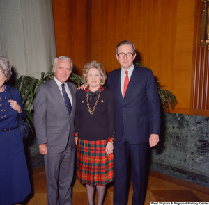 ["An unidentified supporter poses for a photograph with Senator John D. (Jay) Rockefeller and his wife Sharon at the Senate Swearing-In Ceremony."]%