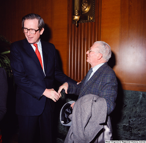 ["Senator John D. (Jay) Rockefeller greets an unidentified supporter at the Senate Swearing-In Ceremony."]%