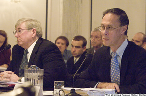 ["Two men testify before the Senate Select Committee on Intelligence."]%
