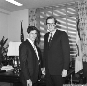 ["Senator John D. (Jay) Rockefeller stands for a photograph with an unidentified individual in his Washington office."]%