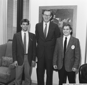 ["Senator John D. (Jay) Rockefeller stands between two participants in the Presidential Classroom for Young Americans."]%