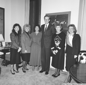 ["Senator John D. (Jay) Rockefeller stands with five representatives from the West Virginia Community Health Center."]%