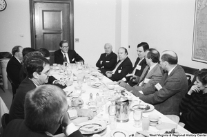 ["Senator John D. (Jay) Rockefeller sits and listens to someone speak during a breakfast with representatives from West Virginia hospitals."]%