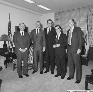 ["Senator John D. (Jay) Rockefeller stands in his office with a group of international representatives from Sieman."]%