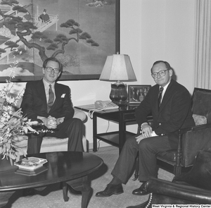 ["Senator John D. (Jay) Rockefeller sits on the couch in his office beside the president of Salem College."]%