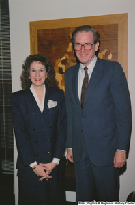 ["Senator John D. (Jay) Rockefeller stands with an unidentified woman in his office."]%