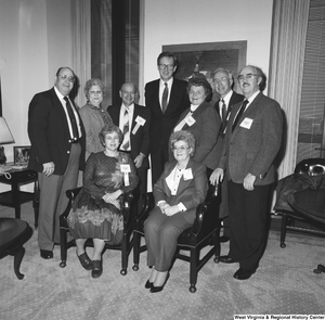 ["Senator John D. (Jay) Rockefeller stands with a group of unidentified individuals in his office."]%