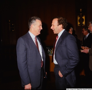 ["Two of Senator John D. (Jay) Rockefeller's staff members chat during a banquet at the Senate."]%