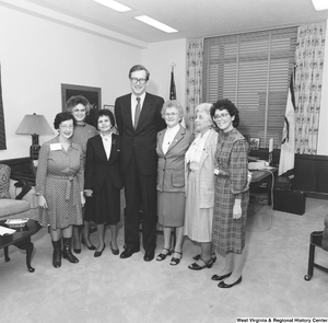 ["Senator John D. (Jay) Rockefeller stands for a photograph with several representatives from the West Virginia Federation of Business and Professional Women."]%
