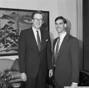 ["Senator John D. (Jay) Rockefeller stands beside former West Virginia University quarterback Oliver Luck."]%