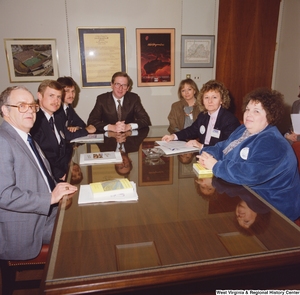 ["Senator John D. (Jay) Rockefeller sits at a conference table with representatives from the National Treasury Employees Union."]%