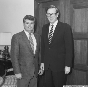 ["Senator John D. (Jay) Rockefeller meets with an unidentified individual in his office in Washington, D.C."]%
