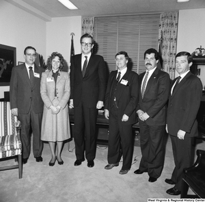 ["Senator John D. (Jay) Rockefeller stands for a photograph with five representatives from the West Virginia Vocational Administration in his Washington office."]%