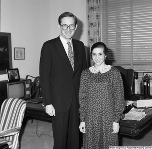 ["Senator John D. (Jay) Rockefeller stands next to an unidentified young woman in his office."]%