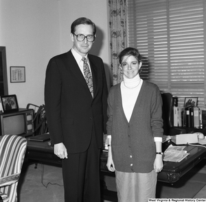 ["Senator John D. (Jay) Rockefeller stands next to an unidentified young woman in his Washington office."]%