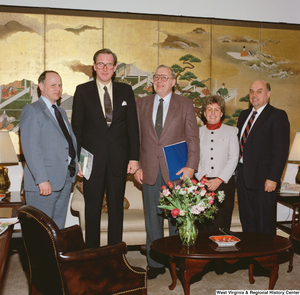 ["Senator John D. (Jay) Rockefeller stands with four individuals in his office."]%