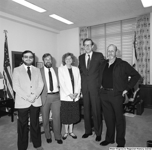 ["Senator John D. (Jay) Rockefeller stands with four members of the Martinsburg tri-county AFL-CIO in his Washington office."]%