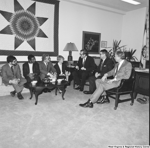 ["Senator John D. (Jay) Rockefeller speaks with a group of individuals from Capitol Theater Restoration in his office."]%
