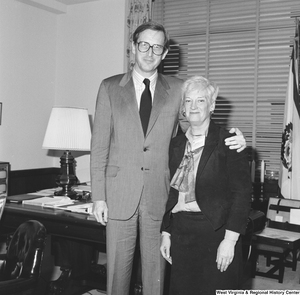 ["Senator John D. (Jay) Rockefeller poses for a photograph with an unidentified woman in his office."]%