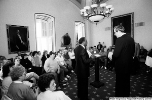 ["Senator John D. (Jay) Rockefeller prepares to speak with an audience about black lung disease in West Virginia."]%